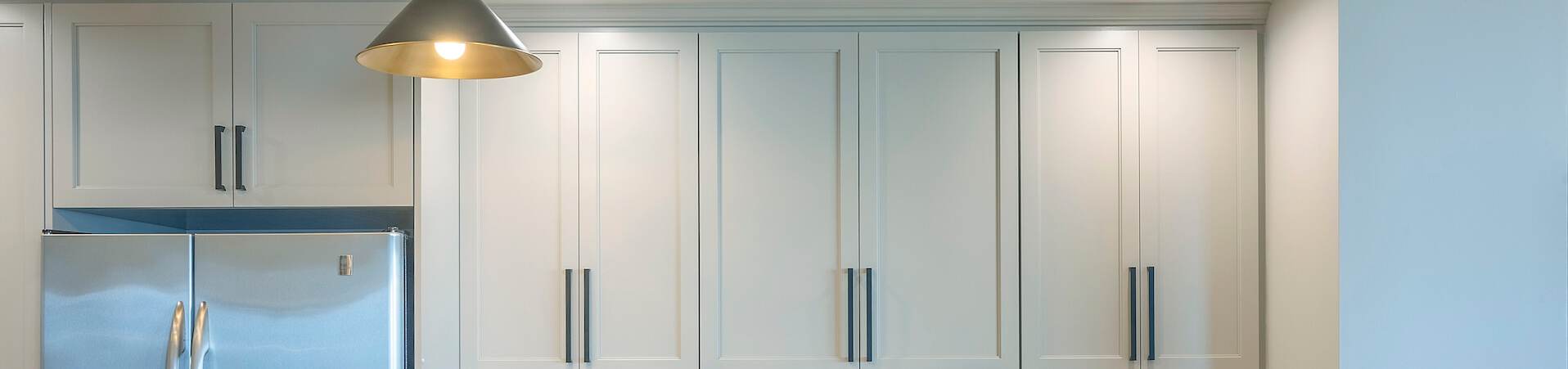 Photo of kitchen with blue and white refinished cabinets