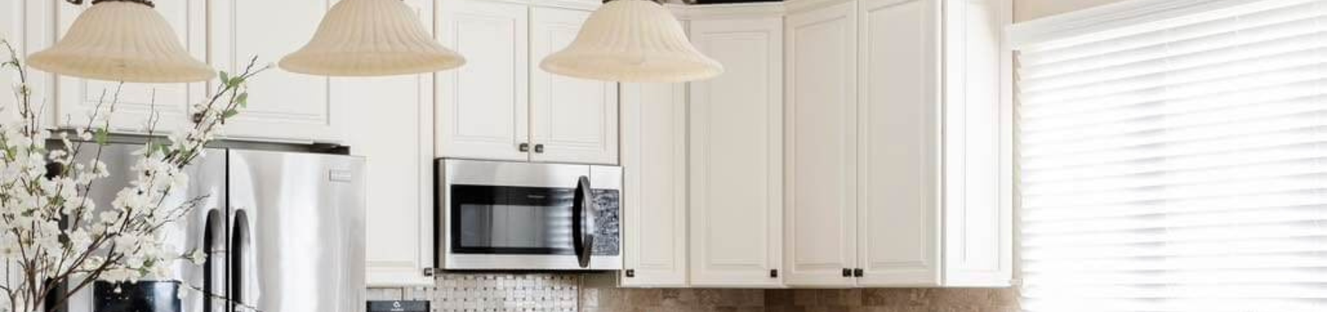 Photo of kitchen with blue and white refinished cabinets