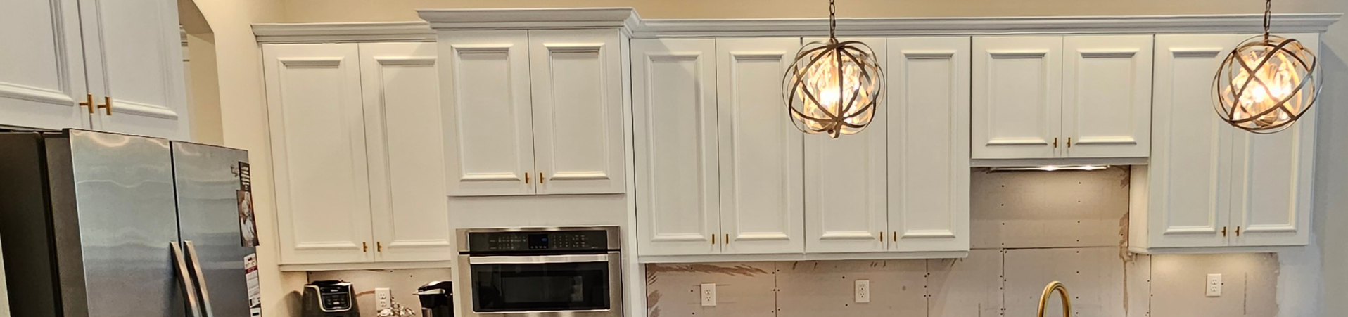 Photo of kitchen with blue and white refinished cabinets