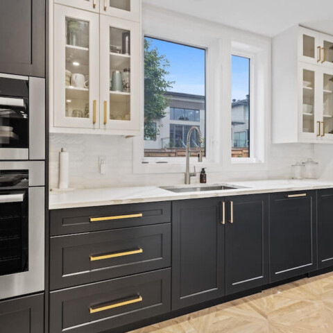 kitchen with dark wooden cabinets and white marble countertops