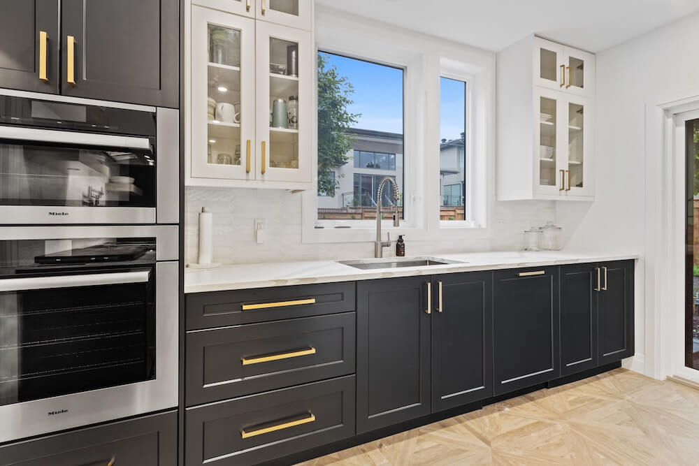 kitchen with dark wooden cabinets and white marble countertops