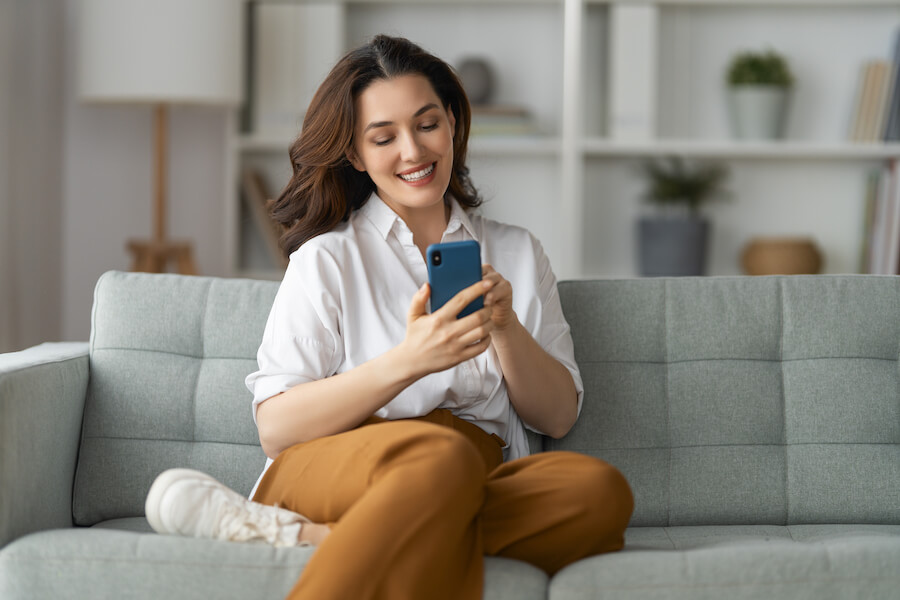 woman using phone to see financing options for kitchen remodel