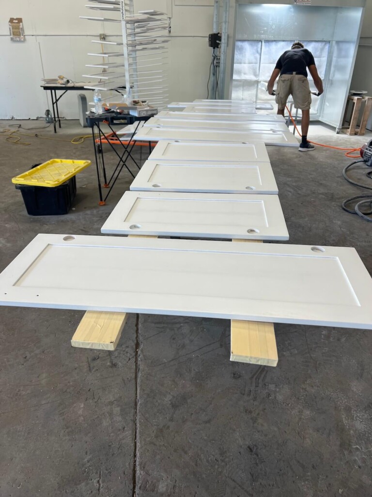 cabinet doors drying after being painted