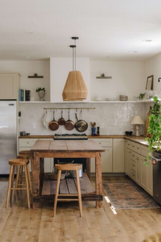 rustic kitchen with painted cabinets and island