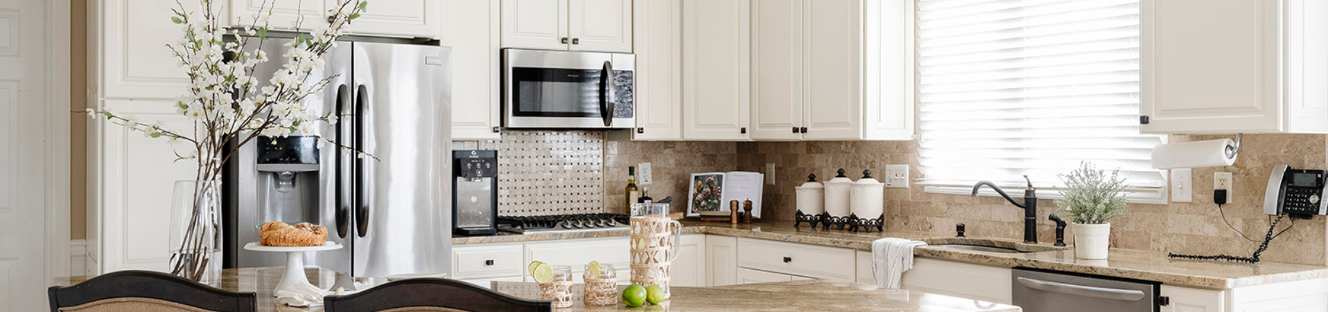 Photo of kitchen with blue and white refinished cabinets