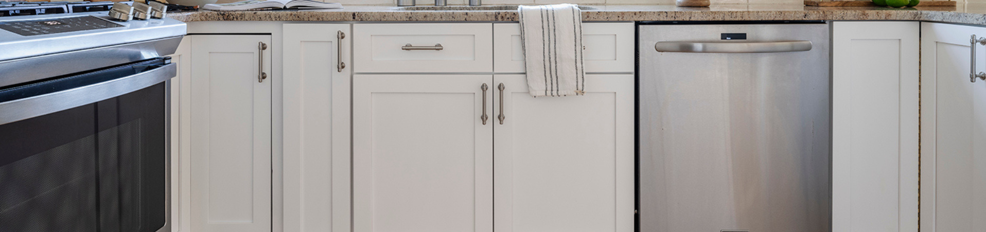 Photo of kitchen with blue and white refinished cabinets