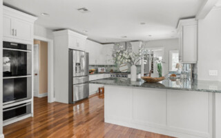 kitchen with white painted cabinets
