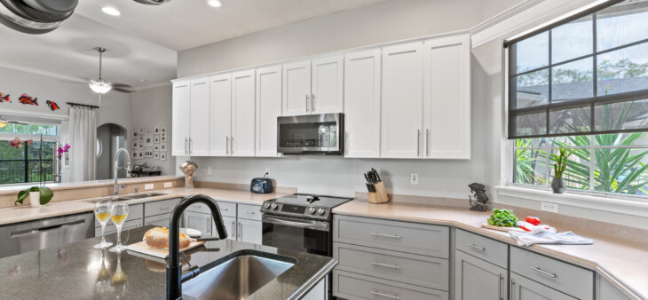 Modern Kitchen With White and Gray Refinished Cabinets