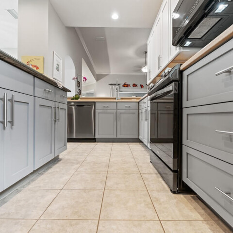 kitchen with light gray painted cabinets