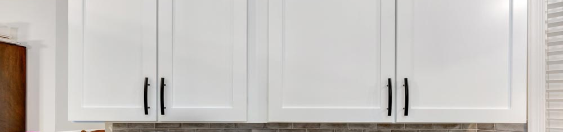 Photo of kitchen with blue and white refinished cabinets