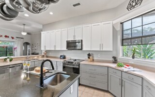 kitchen with white and gray cabinets