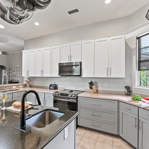 kitchen with white and gray cabinets