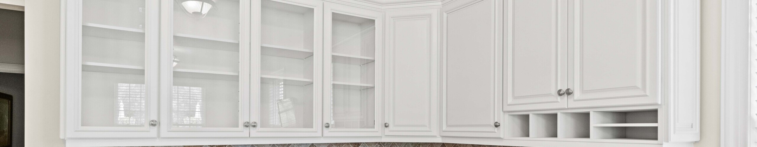 Photo of kitchen with blue and white refinished cabinets