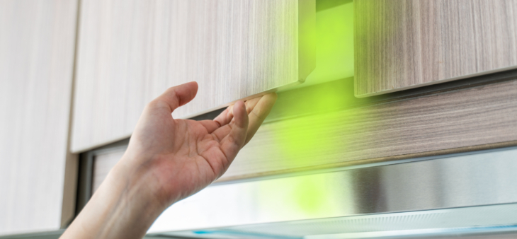 woman opening cabinet with musty smell