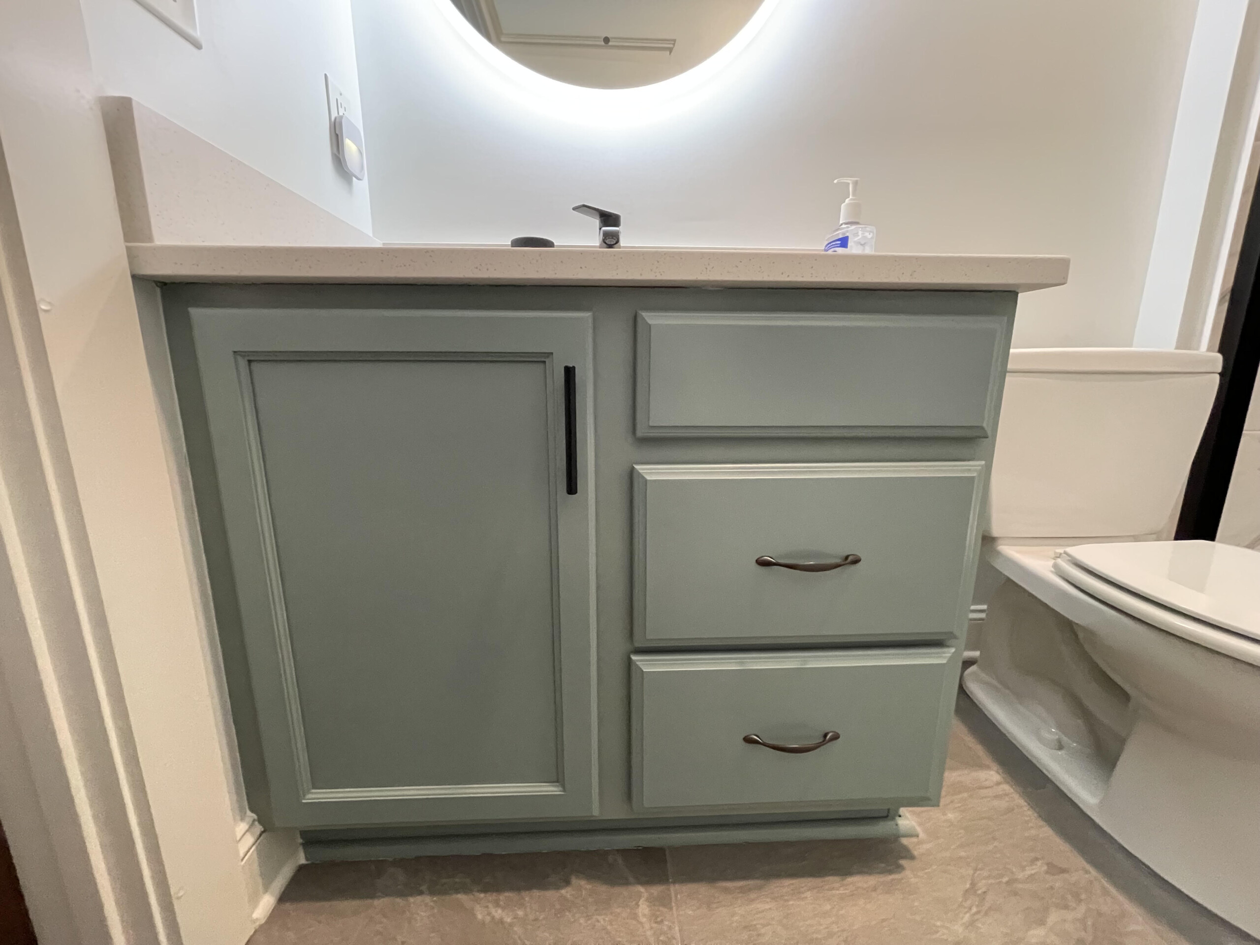 a teal bathroom vanity