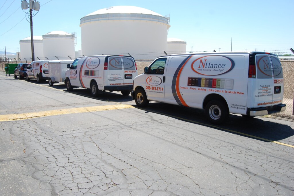 several nhance of boise service vans parked in a commercial area in boise, id