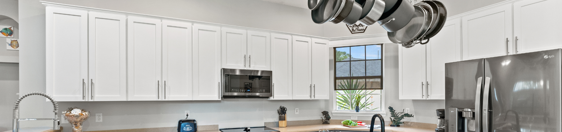 Photo of kitchen with blue and white refinished cabinets