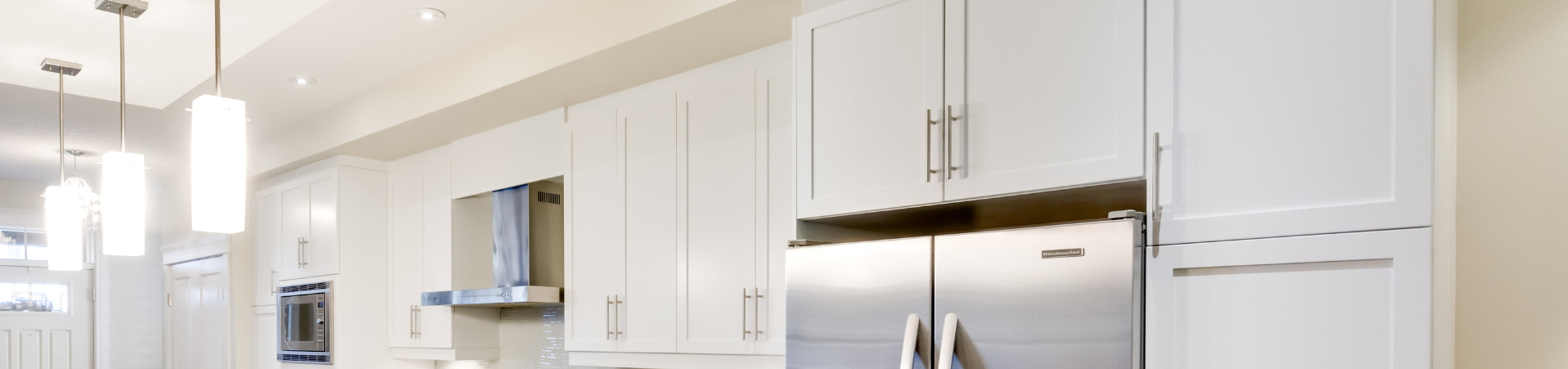 Photo of kitchen with blue and white refinished cabinets