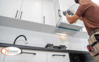 Man adding kitchen cabinet hardware