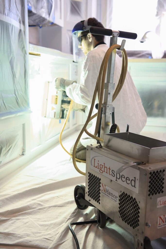 N-Hance technician using Lightspeed Nano UV technology to instantly cure cabinets in basking ridge