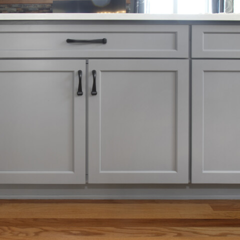 Grey cabinets with black bar hardware