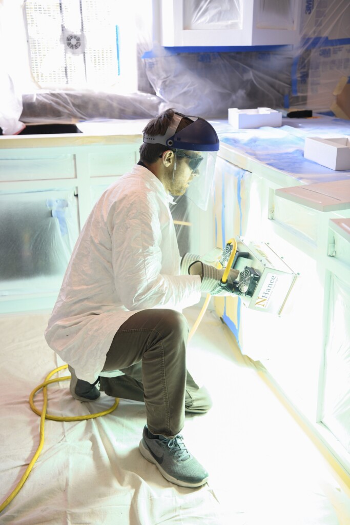 cabinet refacing cumming ga technician working on project