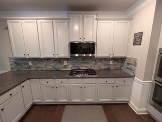 white refinished kitchen cabinet