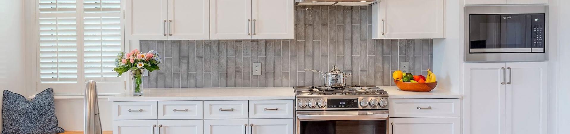 Photo of kitchen with blue and white refinished cabinets