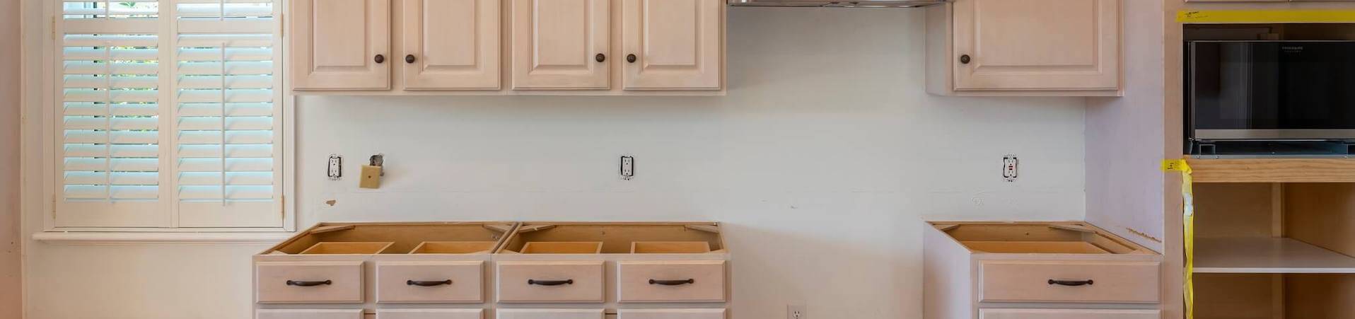 Photo of kitchen with old cabinets before refinishing