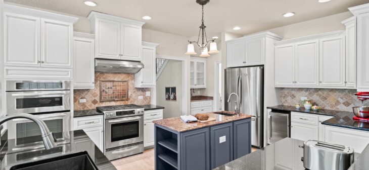 white and navy cabinets in a kitchen