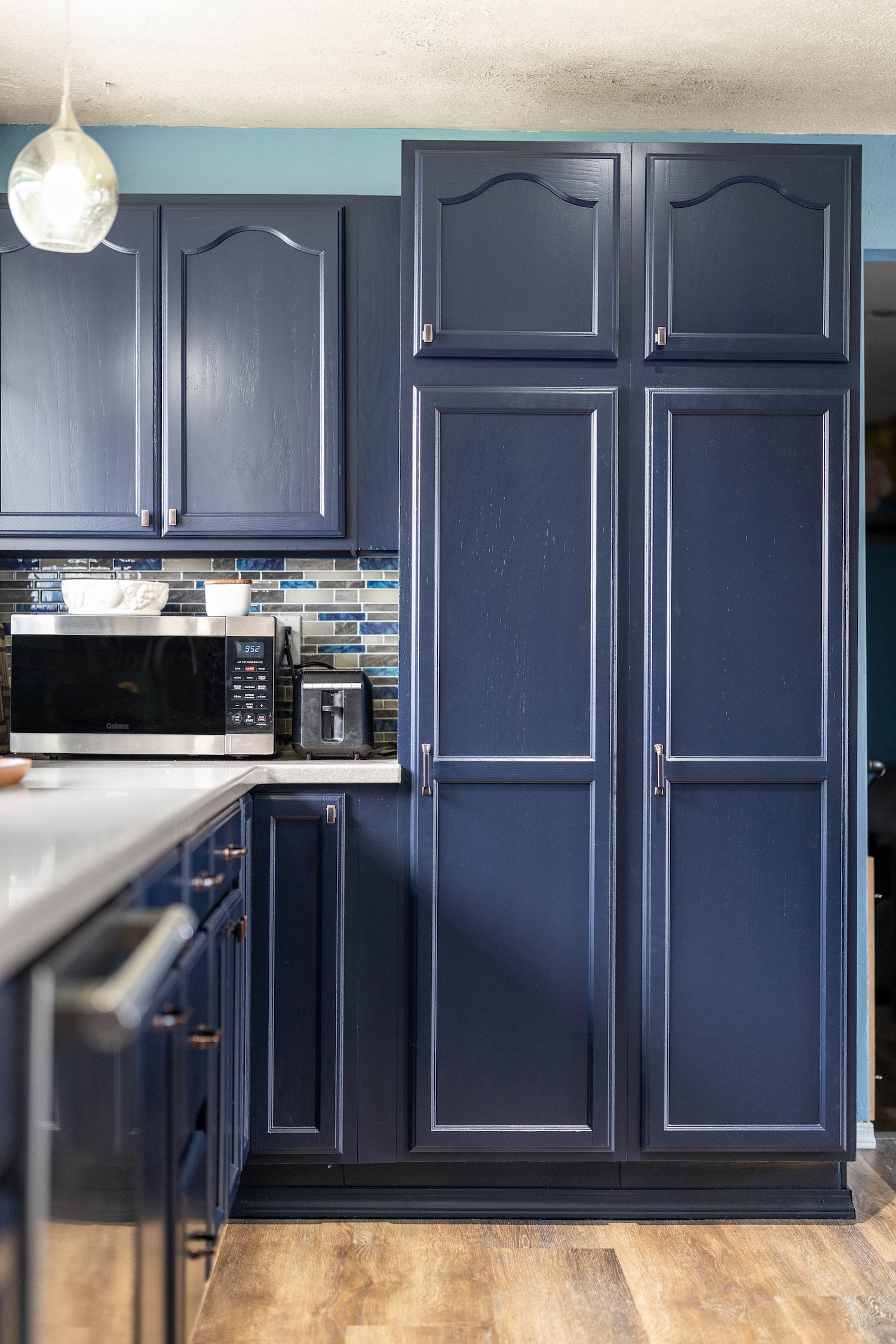 blue cabinet painting in Geist Indiana