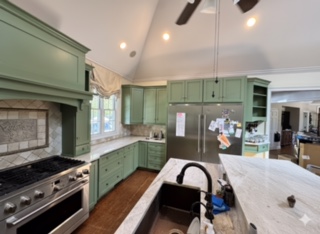 newly refinished kitchen cabinets in green