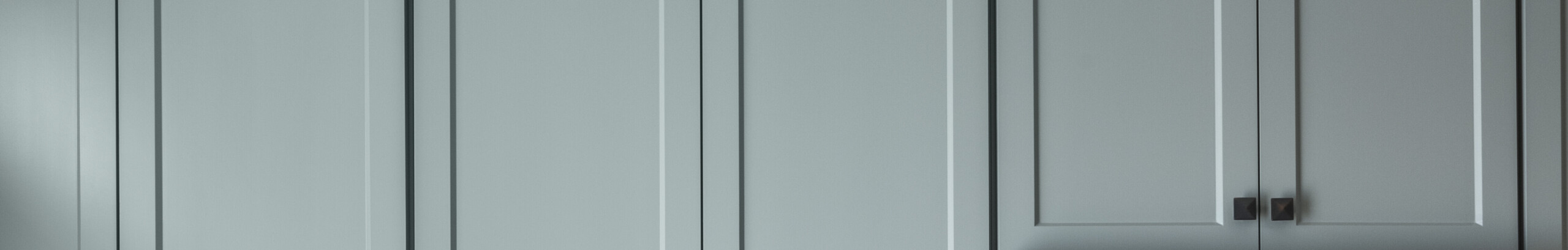 Photo of kitchen with blue and white refinished cabinets