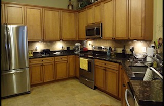 Brown cabinet that needs refinishing