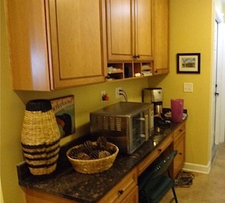 Brown cabinet that needs refinishing