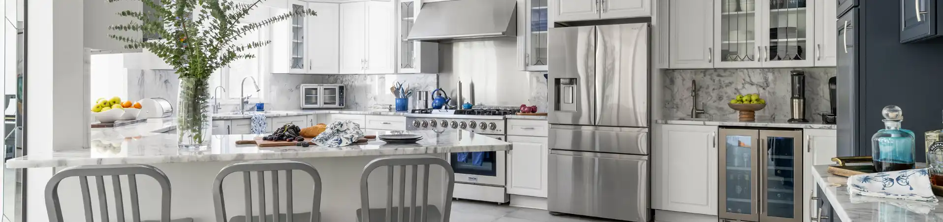 Photo of kitchen with blue and white refinished cabinets