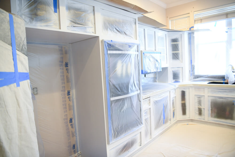 cabinets masked and taped prior to cabinet painting
