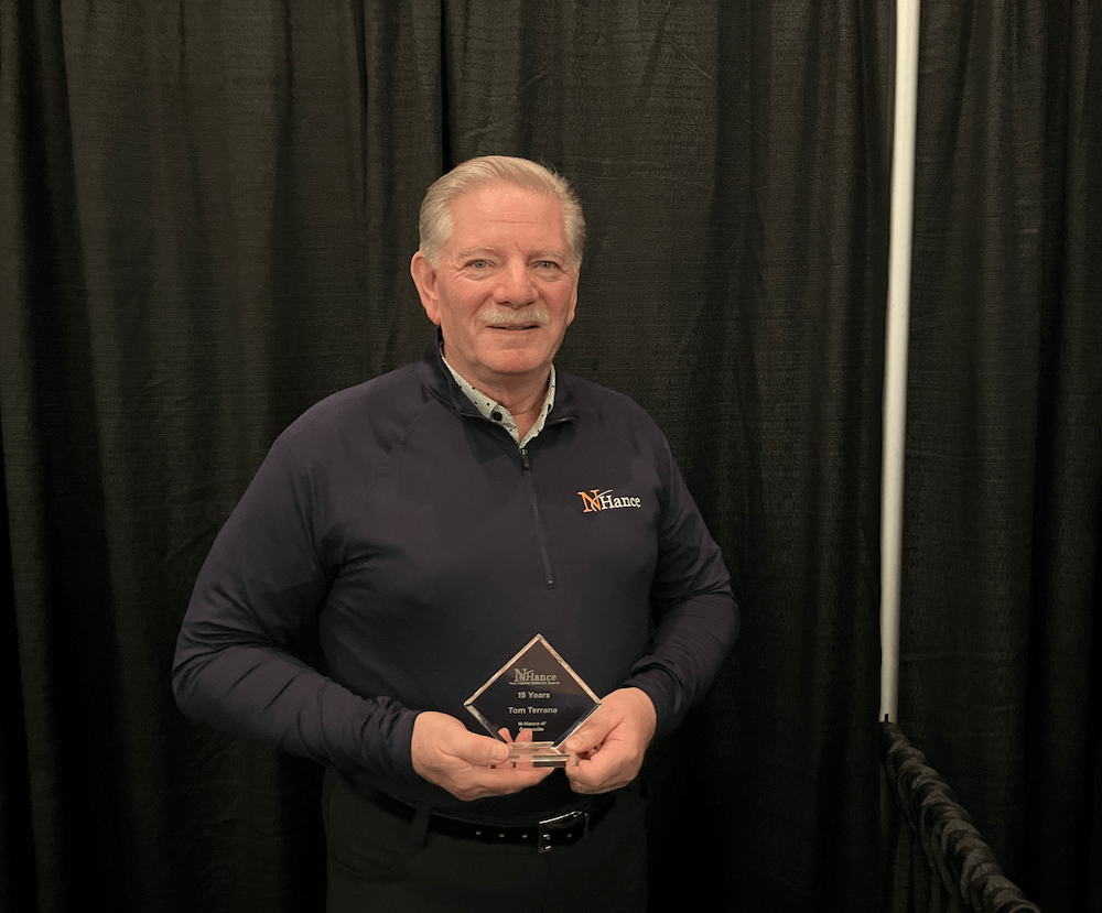 N-Hance Van Photo of tom holding a trophy for 15 years of business