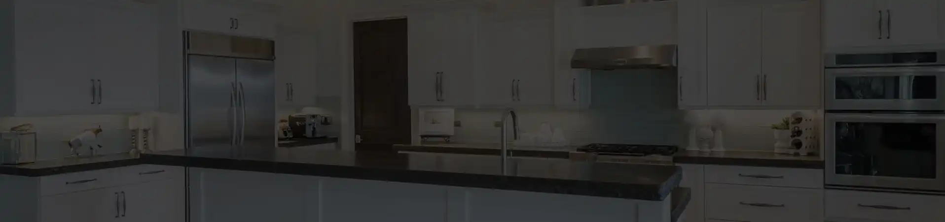 Photo of kitchen with blue and white refinished cabinets