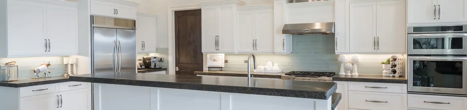 Photo of kitchen with blue and white refinished cabinets